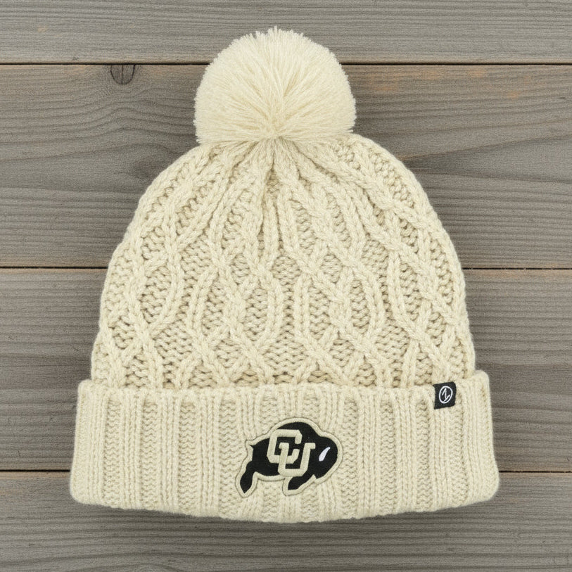Cream knit beanie with pom-pom and Colorado Buffaloes logo embroidered on the front.