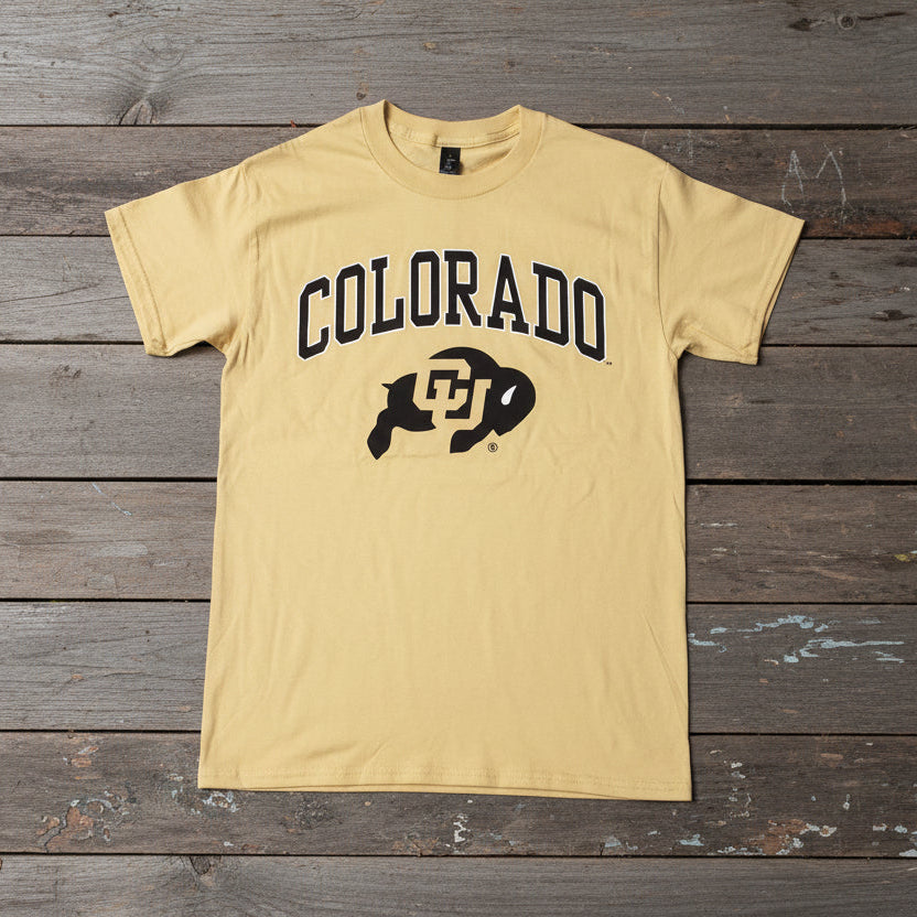 Yellow t-shirt with 'Colorado' and Ralphie logo, laying on weathered boards.
