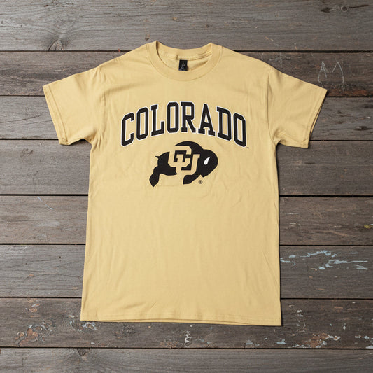 Yellow t-shirt with 'Colorado' and Ralphie logo, laying on weathered boards.